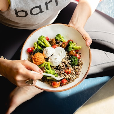 A bowl of seed-oil-free food on a wooden table.